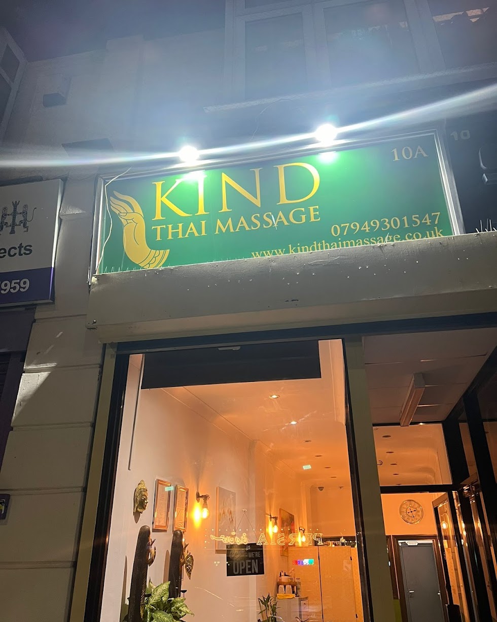 Kind Thai Massage storefront at night
