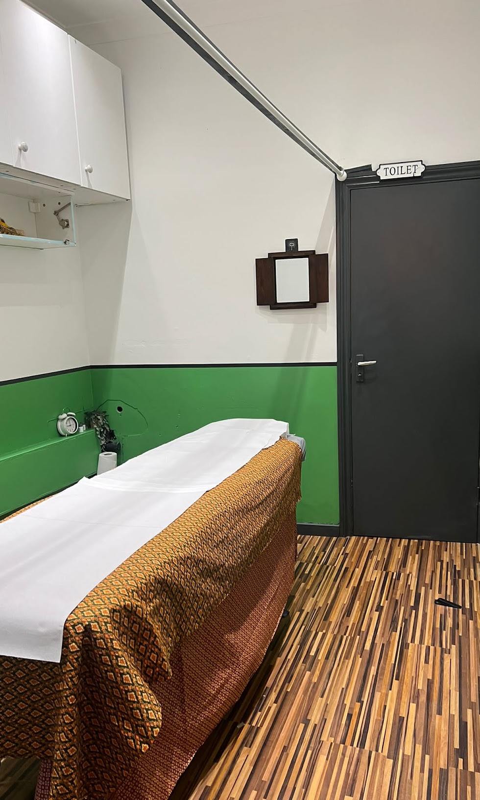 Treatment room with massage bed